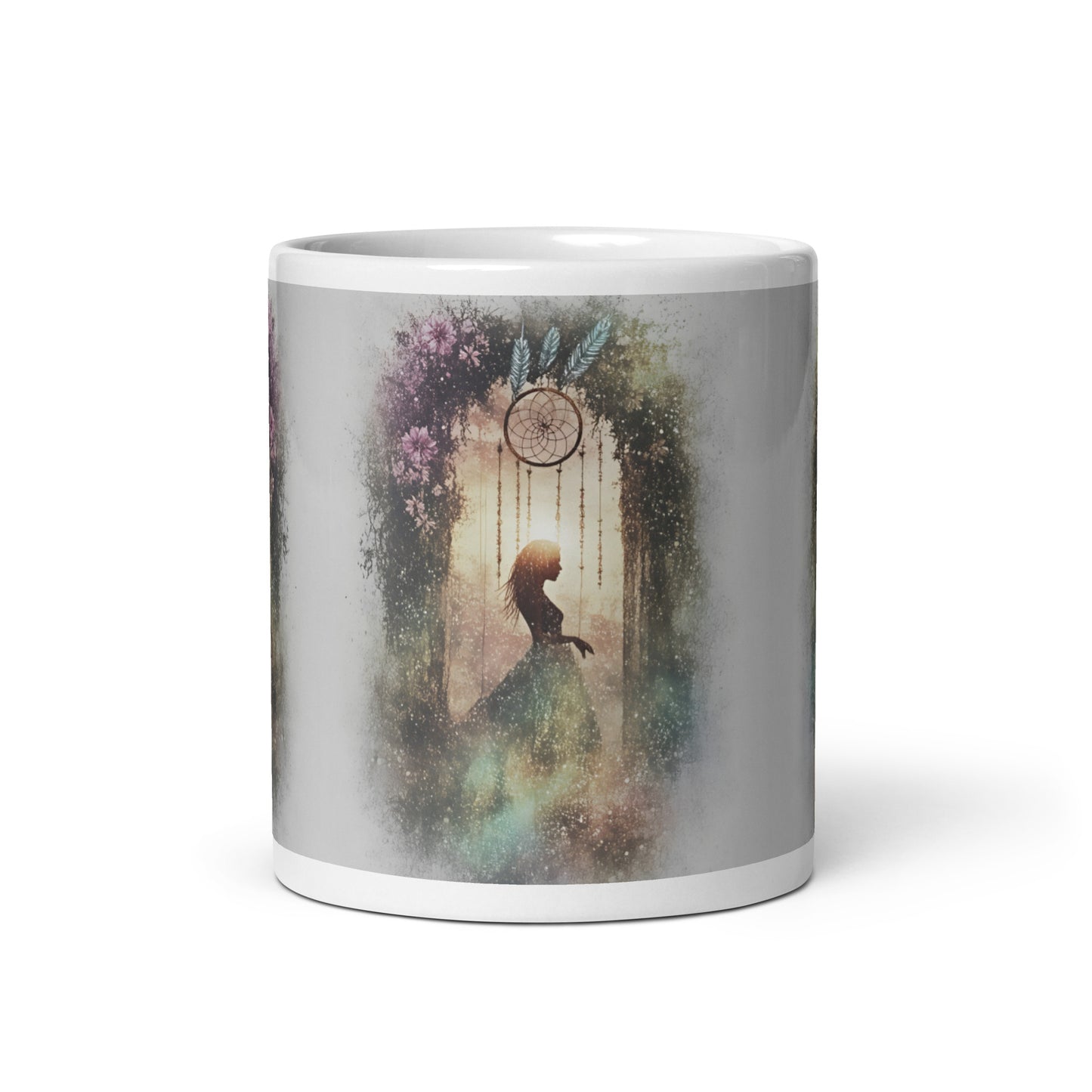 Mug with a decorative design of a silhouette, flowers, and a dreamcatcher on a white background