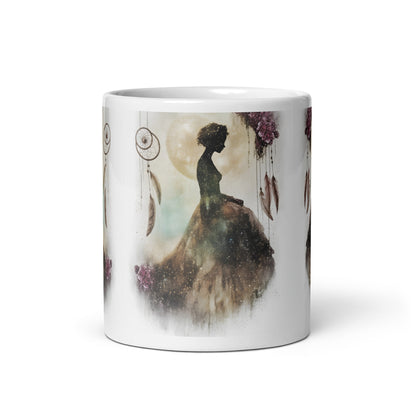 White mug with a artistic silhouette design of a woman in a flowing dress on a white background